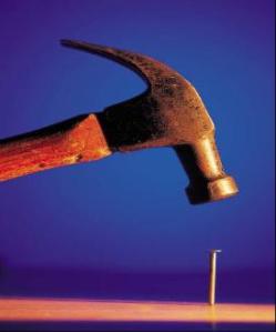 Hammer_hitting_Nail-274x330